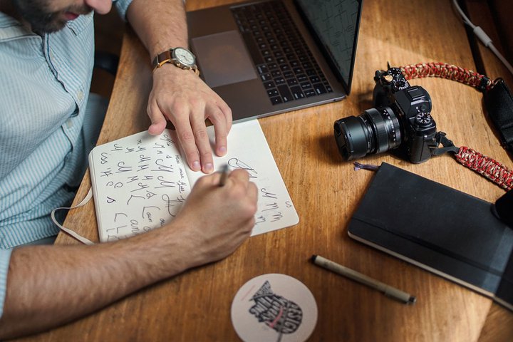 Man sketching logo ideas